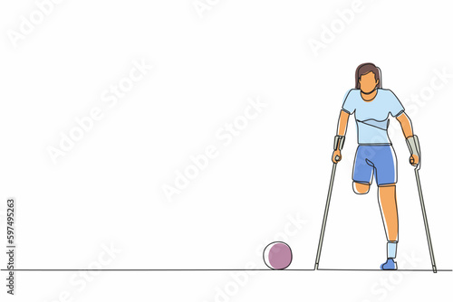 Single continuous line drawing disabled woman with crutches playing football in stadium. Disability soccer athlete. Amputated sportswoman playing on sport competition. One line graphic design vector