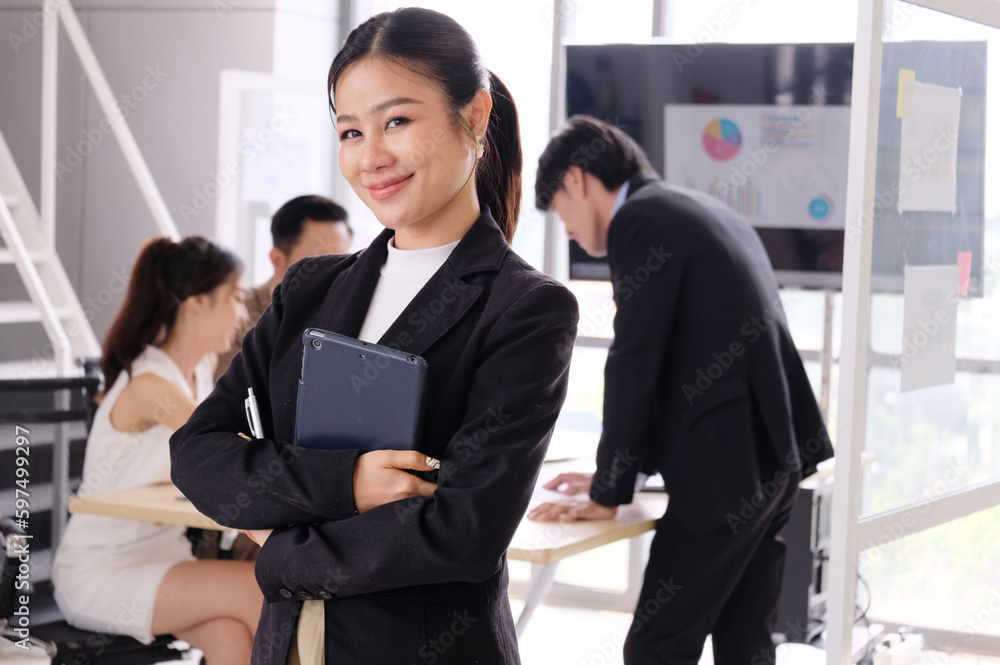 sitting business woman standing smiling at work. sitting business woman standing smiling at work.