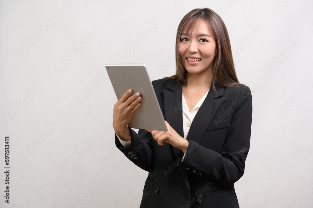 Young asian businesswoman using tablet over white background, technology concept Young asian businesswoman using tablet over white background, technology concept