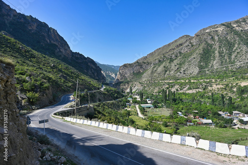 Highway road through the Karakoisu mountain river valley