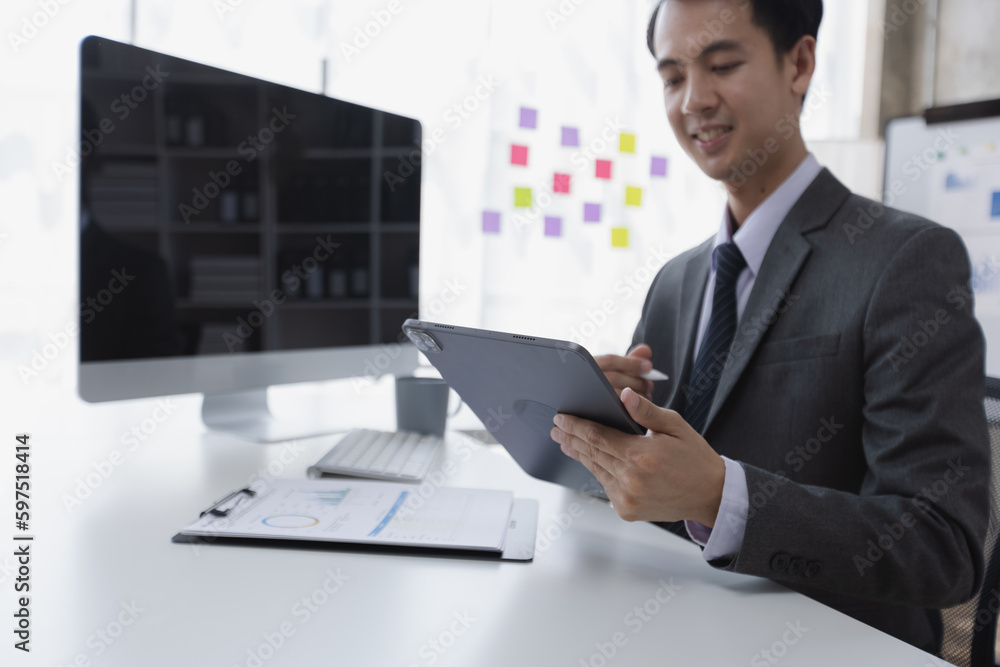 professional adult Asian businessman working at office table, Male accountant financial concept. professional adult Asian businessman working at office table, Male accountant financial concept.