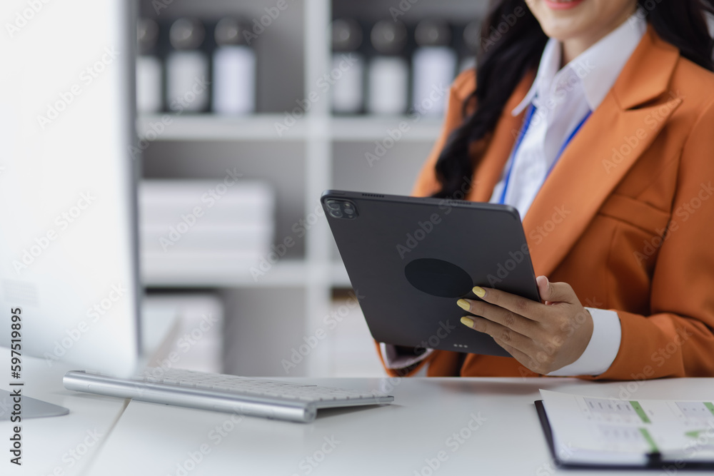Asian businesswoman working on e-Commerce project marketing, Business and investment finance with growth graph. Asian businesswoman working on e-Commerce project marketing, Business and investment finance with growth graph.