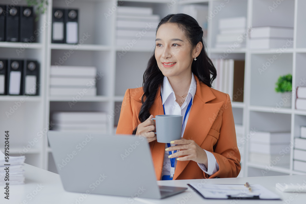 professional adult Asian business woman working at office table, Female accountant financial concept. professional adult Asian business woman working at office table, Female accountant financial concept.