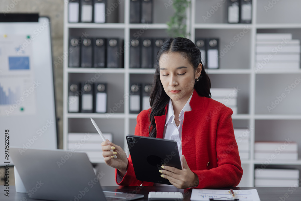 Asian business woman working at table office, business finance technology, financial document and business accounting. Asian business woman working at table office, business finance technology, financial document and business accounting.