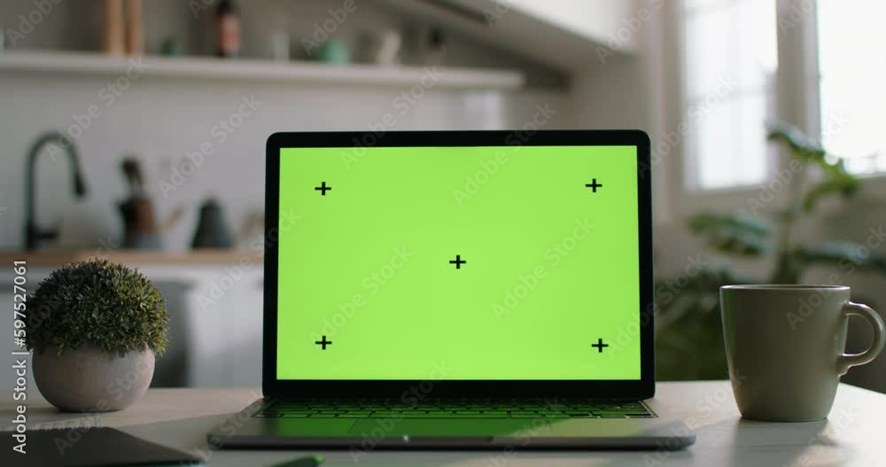 Camera zooms out from laptop mockup with green screen. Perfect place