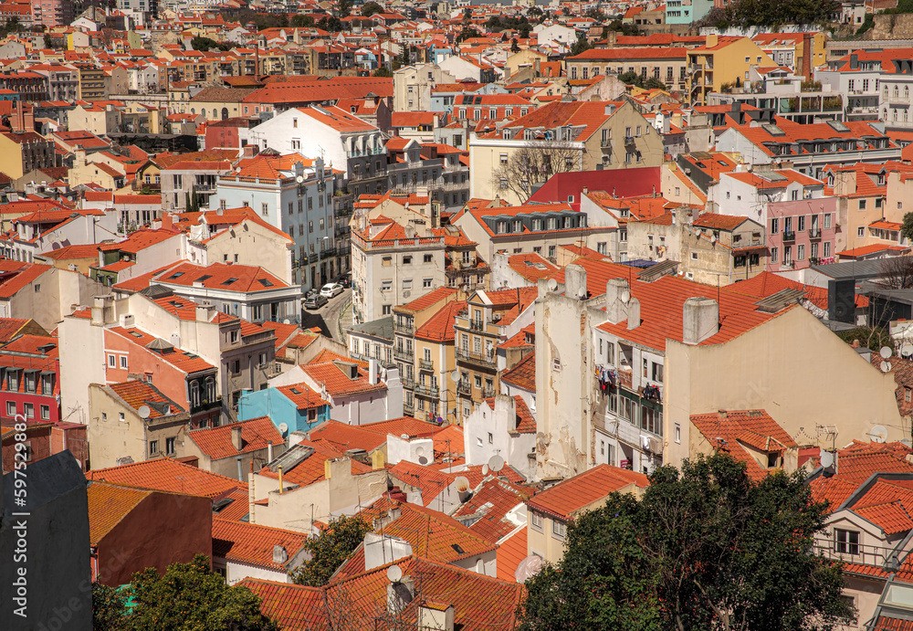 Lisbon. European city. Old traditional building. Red tiled roofs.
