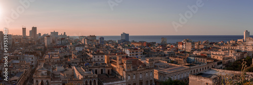 View over the rooftops of Havana in Cuba at sunset with the El National hotel