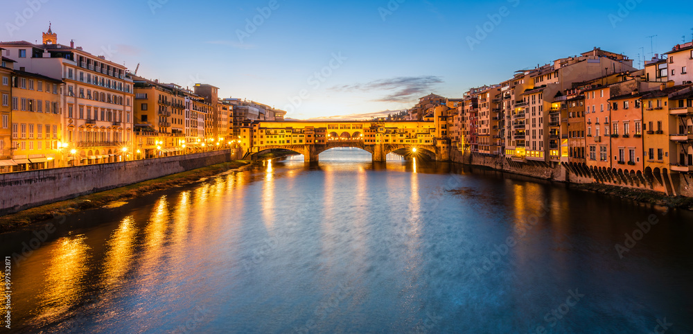 UNESCO site Ponte Vecchio in Florence early in the morning dawn.