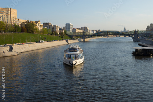 View of the embankment of the Moscow River with a pleasure boat.