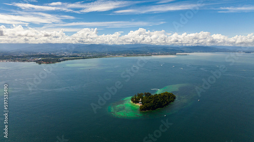 The coast of the island of Borneo and the island of Mamutik. Tunku Abdul Rahman National Park. Kota Kinabalu, Sabah, Malaysia. photo