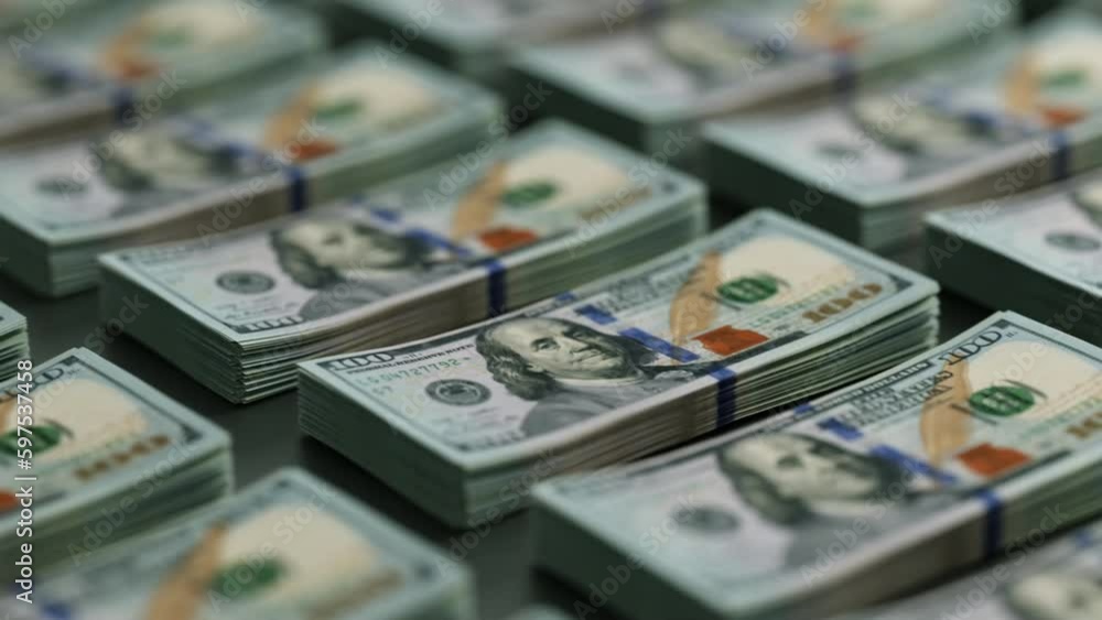 Stacks of One hundred dollar bills in even rows