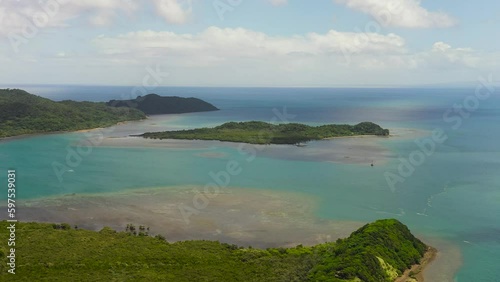 Aerial view of Island with rainforest and jungle. Palaui Island. Santa Ana, Cagayan. Philippines. photo