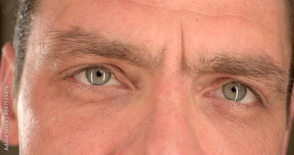 Soft focus of the eyes of a man in a portrait, close-up of the face. He moves in a field of clarity. Eyebrows over eyes black hair. Attentive look. Soft focus of the eyes of a man in a portrait, close-up of the face. He moves in a field of clarity. Eyebrows over eyes black hair. Attentive look.