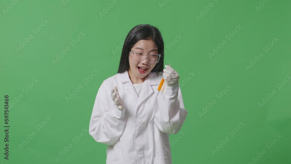 Asian Woman Scientist Looking At The Orange Liquid In The Test Tube And Saying Wow While Standing On The Green Screen Background In The Laboratory
Asian Woman Scientist Looking At The Orange Liquid In The Test Tube And Saying Wow While Standing On The Green Screen Background In The Laboratory