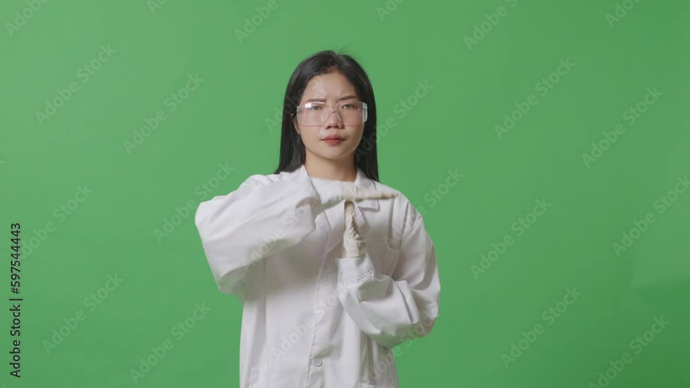 Upset Asian Woman Scientist Shaking Her Head And Doing Time Out Gesture With Hands While Standing On The Green Screen Background In The Laboratory
Upset Asian Woman Scientist Shaking Her Head And Doing Time Out Gesture With Hands While Standing On The Green Screen Background In The Laboratory