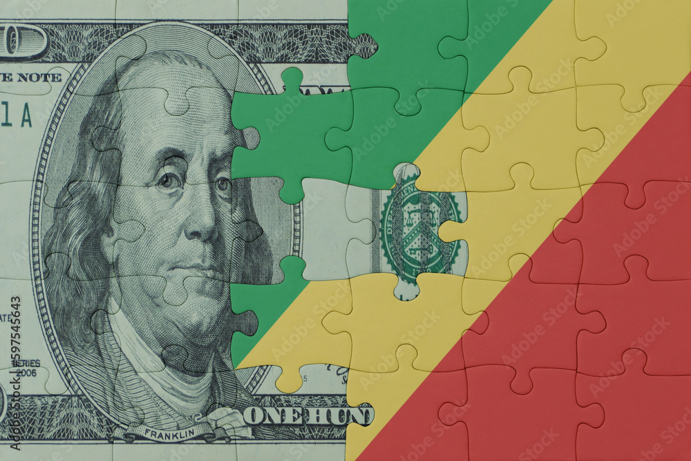 puzzle with the national flag of republic of the congo and dollar money banknote. macro.concept.