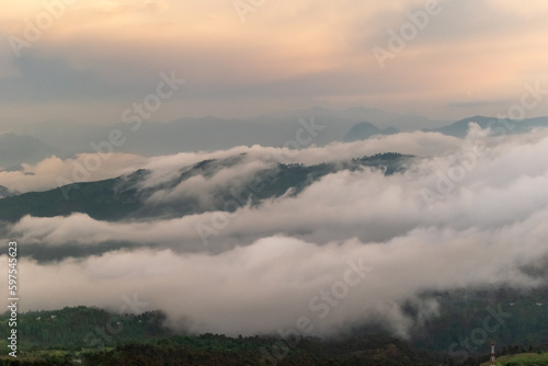 Beautiful view of clouds and mist covering mountain ranges in the Himalayan village of Chaukori in Kumaon.