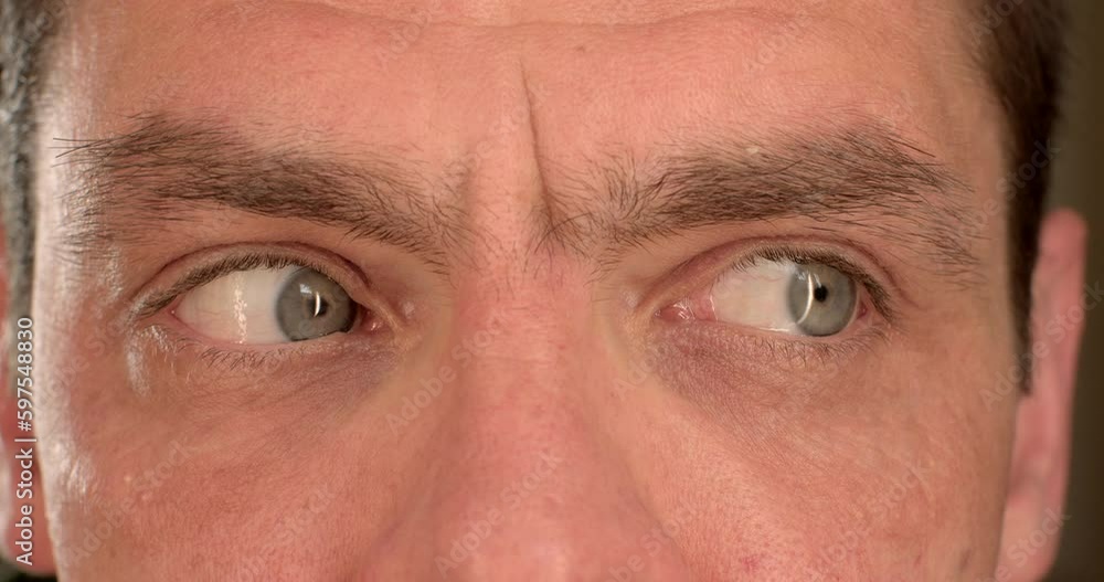 Eye training, a man makes a movement to the left, to the right to increase the tone of the organ of vision. Load on the internal organs, shifting the focus of attention. Eye training, a man makes a movement to the left, to the right to increase the tone of the organ of vision. Load on the internal organs, shifting the focus of attention.