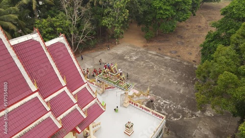 High-Angle Video of the Merit Making Ceremony, Buddhist Monk Ordination, Surat Thani Province, Near Tapee River photo