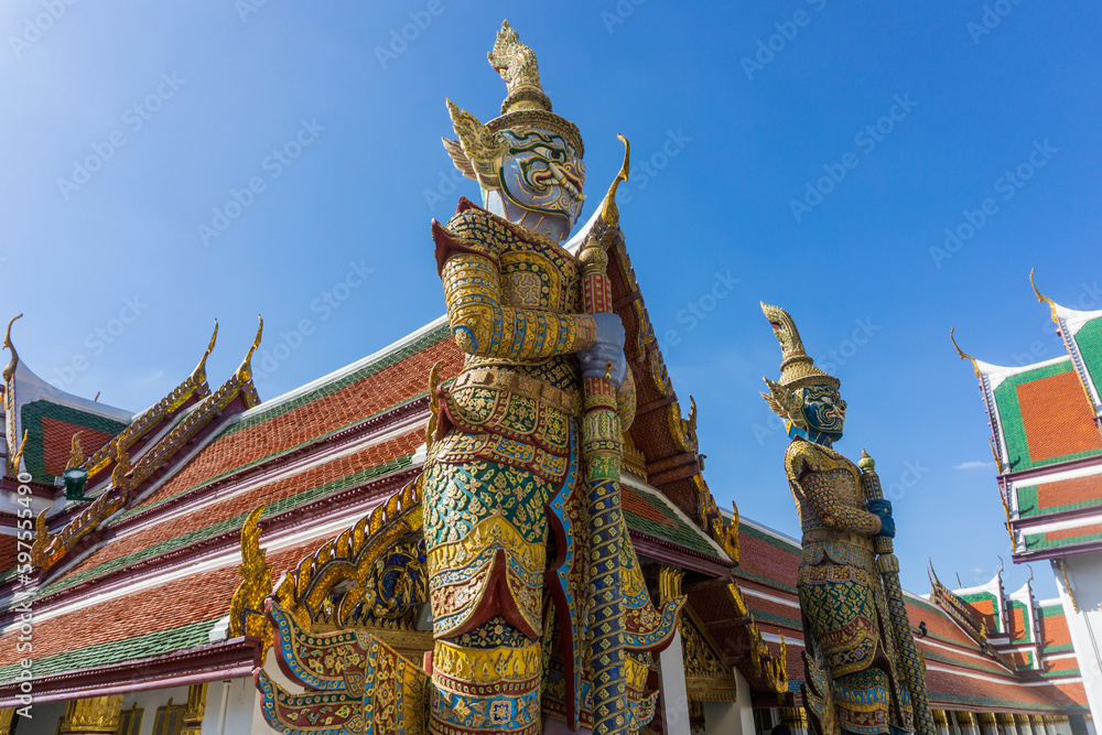 Fototapeta premium Yasha guardians at entrance of Emerald Temple inside Golden Grand Palace in Bangkok, Thailand. Wat Phra Kaew Temple.