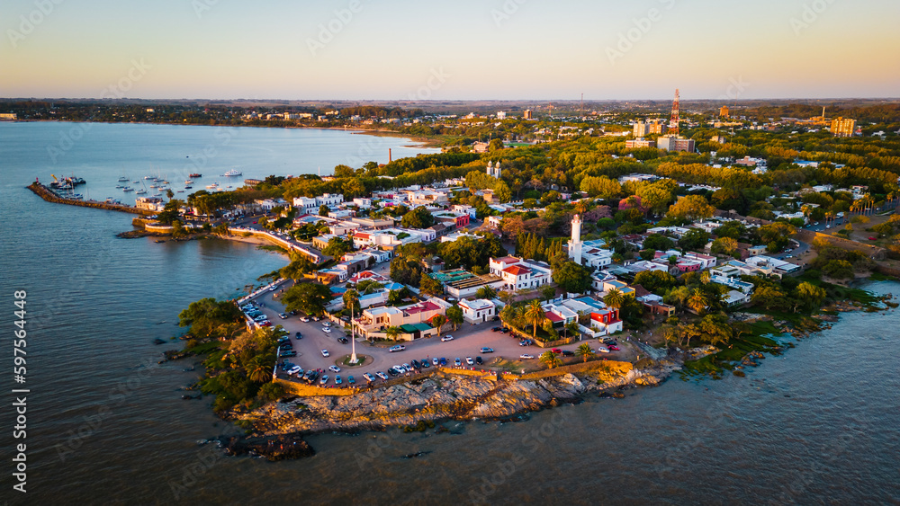 Aerial view Colonia del Sacramento old city lighthouse with glowing sunrise on the Uruguay Aerial view Colonia del Sacramento old city lighthouse with glowing sunrise on the Uruguay