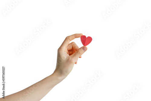 hand holds a small red paper heart. love gift concept.
