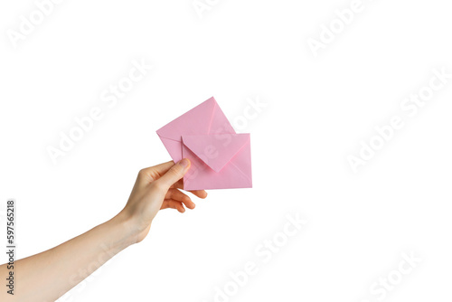 hand holding envelopehand holding an envelope. the concept of sending a letter with a message. delivery of the letter. photo