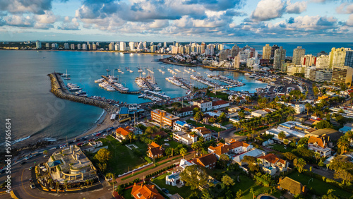 Punta del Este seaside resort and city landscape on the coast of Uruguay with modern skyscraper buildings at sunset photo