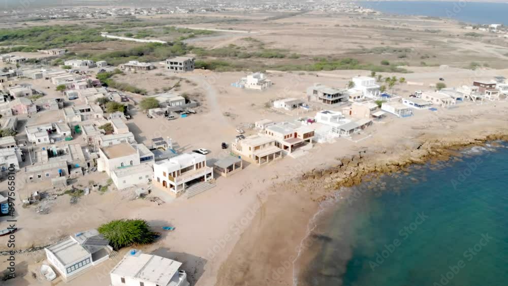 Aerial view of white huts on french beach coastline- moving forward Aerial view of white huts on french beach coastline- moving forward