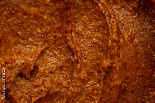 Baby food, vegetable puree close-up. Apple-carrot puree chopped in a blender. Background texture of food for newborn children.