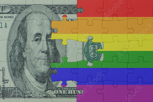 Wallpaper Mural puzzle with the rainbow gay pride flag and dollar money banknote. macro.concept. Torontodigital.ca