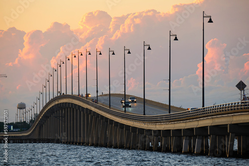 Barron Collier Bridge and Gilchrist Bridge in Florida with moving traffic. Transportation infrastructure in Charlotte County connecting Punta Gorda and Port Charlotte over Peace River