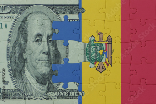 Wallpaper Mural puzzle with the national flag of moldova and dollar money banknote. macro.concept. Torontodigital.ca