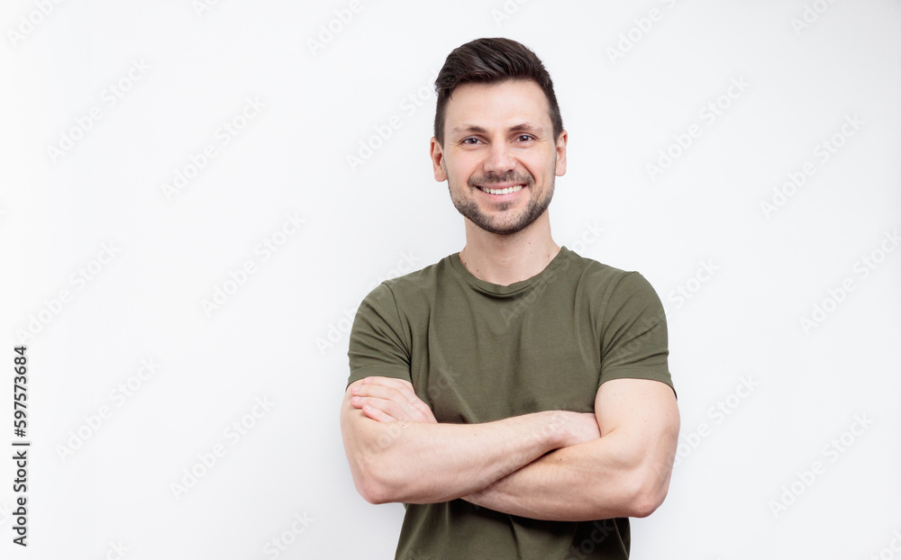Smiling man with crossed arms over white background Smiling man with crossed arms over white background