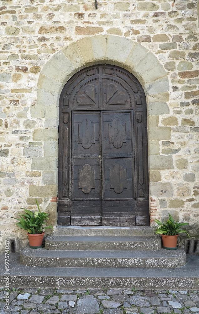 Umbertide San Francesco Church Wooden Entrance with Steps and Plants in Umbria, Italy Umbertide San Francesco Church Wooden Entrance with Steps and Plants in Umbria, Italy