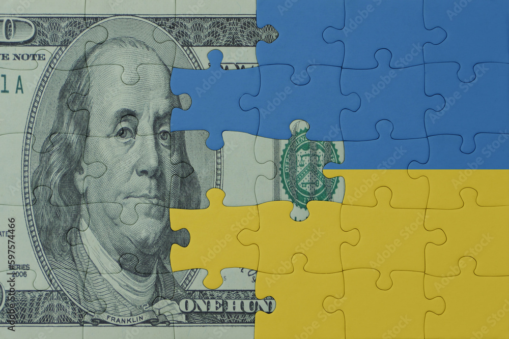 puzzle with the national flag of ukraine and dollar money banknote. macro.concept.