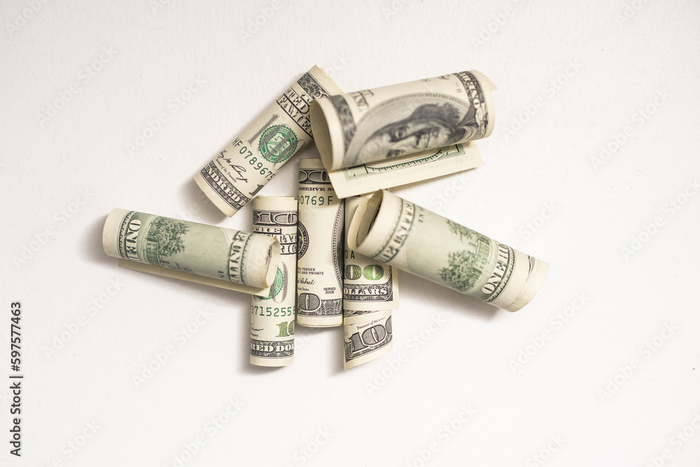Roll of 100 dollar bills on background Roll of 100 dollar bills on background