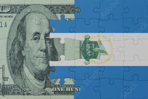 Wallpaper Mural puzzle with the national flag of nicaragua and dollar money banknote. macro.concept. Torontodigital.ca