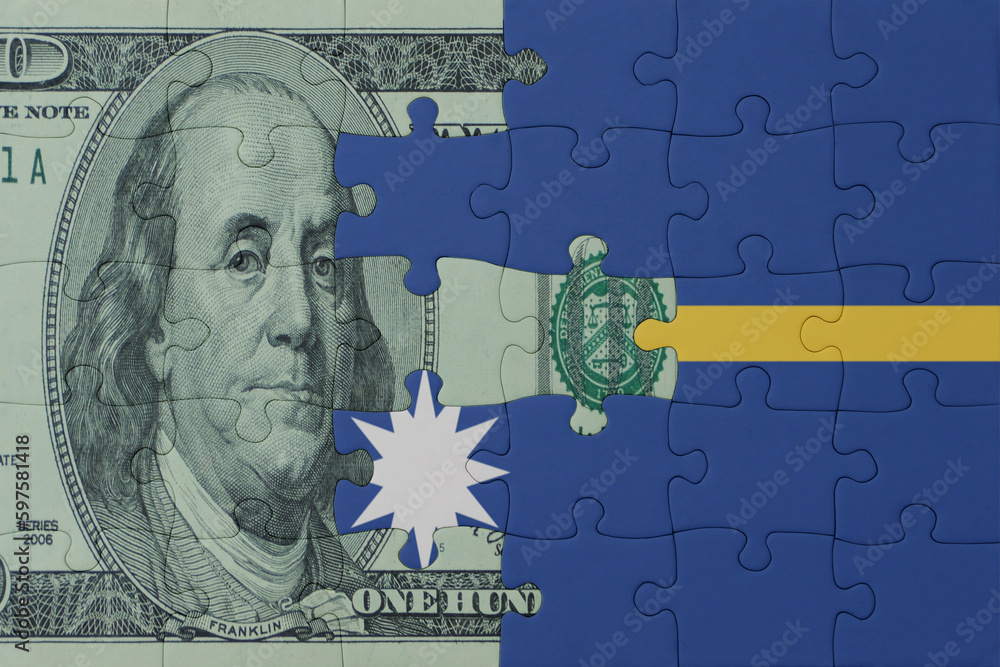 puzzle with the national flag of Nauru and dollar money banknote. macro.concept.
