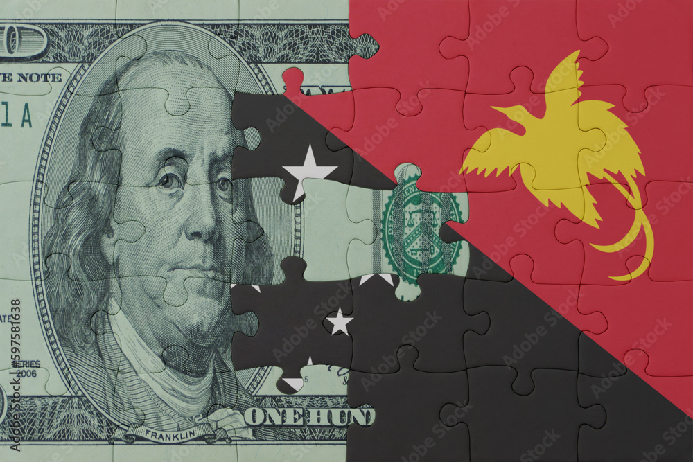 puzzle with the national flag of Papua New Guinea and dollar money banknote. macro.concept.