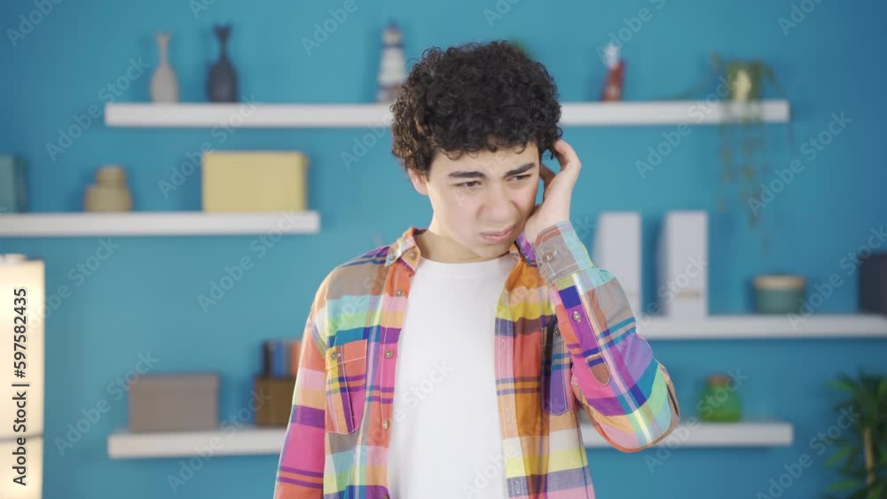 Sick, allergic boy scratching his ears. Sick, allergic boy scratching his ears.