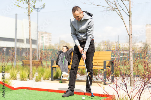 a man goes to the place of impact for playing mini-golf © Angelov