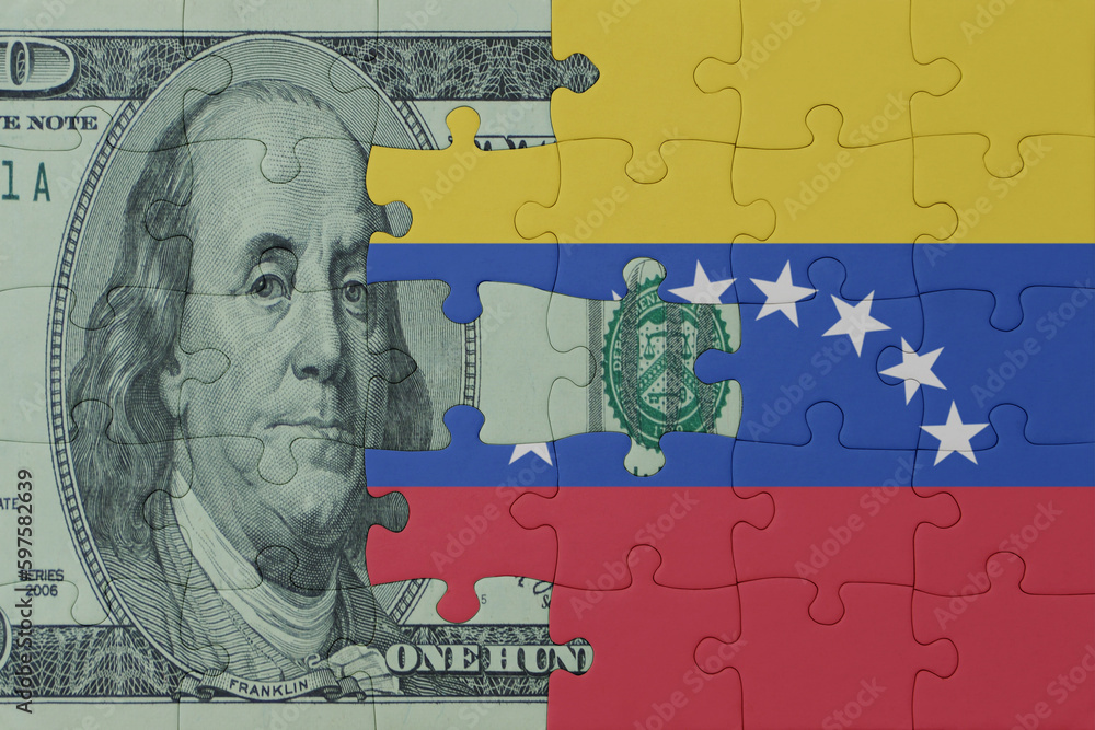 puzzle with the national flag of venezuela and dollar money banknote. macro.concept.