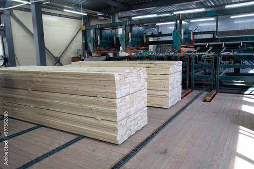 A factory for sawing logs into boards.Timber products warehouse on a specialized site.