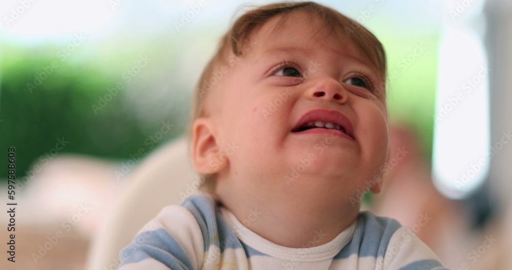 Baby infant child having a tantrum complaining. Toddler boy face cries and complains Baby infant child having a tantrum complaining. Toddler boy face cries and complains