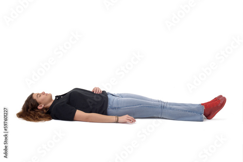 young girl lying on the floor on white background