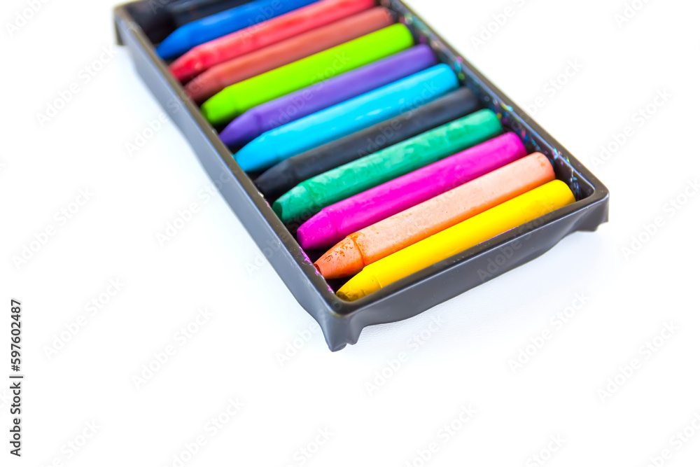 Fototapeta premium Colored crayons on paper background.