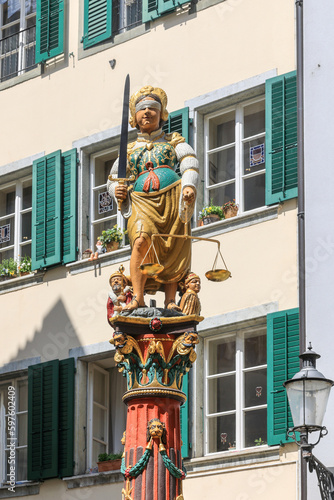 Justice Fountain in Solothurn down town center. Built in 1561, Justice is symbolised by Madame Justitia. She is blindfolded and carries a sword in her right hand and a pair of scales in her left. © Yü Lan