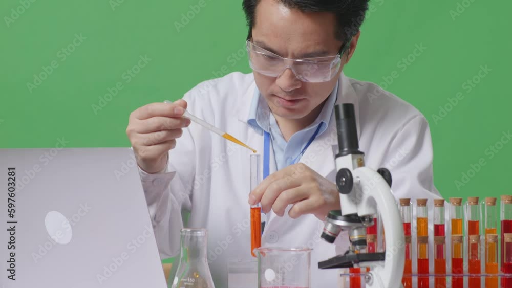 Close Up Of Asian Man Scientist Making Experiment With Test Tube And