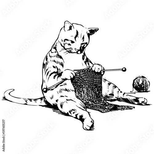 knit cat - sitting upright and knitting a scarf